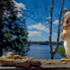 TCR-CH1-Wallpaper-Amy-16x9-1 A red squirrel on the deck with a peanut in its mouth. This picture of a red squirrel standing on its hind legs with a nut in its mouth was taken during filming of the 'Chip Away' series by KiltRockMedia.com. The squirrel's name is Amy.